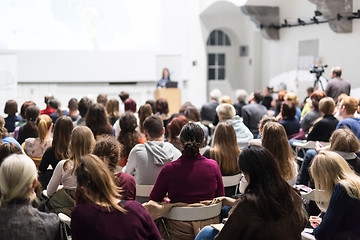 Image showing Woman giving presentation in lecture hall at university.