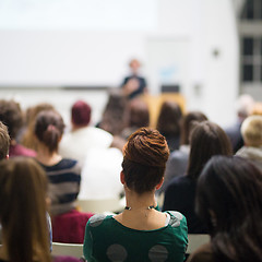 Image showing Woman giving presentation in lecture hall at university.