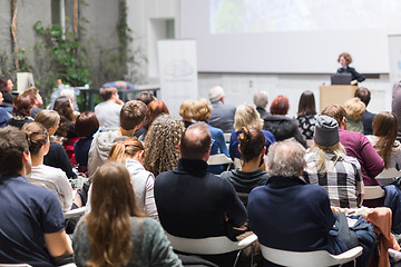 Image showing Woman giving presentation in lecture hall at university.