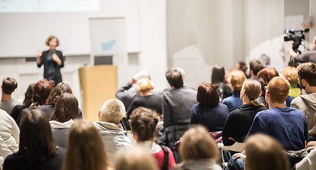 Image showing Woman giving presentation in lecture hall at university.