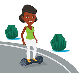 Image showing Woman riding on self-balancing electric scooter.