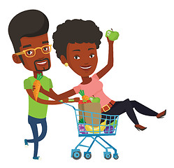 Image showing Couple of friends riding by shopping trolley.