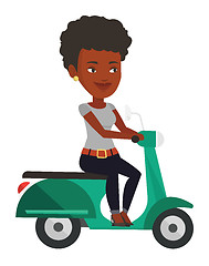 Image showing Young african-american woman riding scooter.