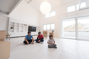 Image showing young boys having fun on the floor