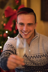 Image showing Happy young man with a glass of champagne