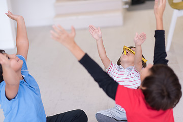 Image showing young boys having fun on the floor