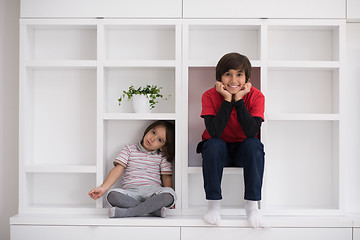 Image showing young boys posing on a shelf