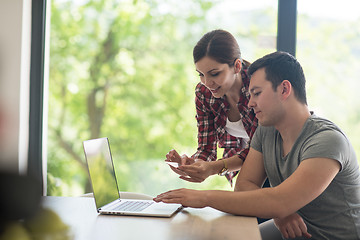 Image showing happy young couple buying online