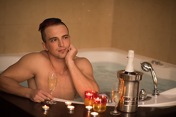 Image showing man relaxing in the jacuzzi