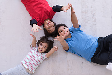 Image showing young boys having fun on the floor