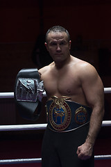 Image showing kick boxer with his championship belt