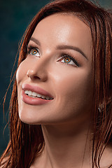 Image showing Beautiful woman face portrait close up on dark