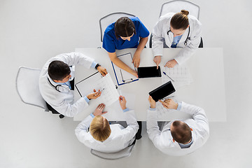 Image showing doctors with cardiograms and tablet pc at hospital