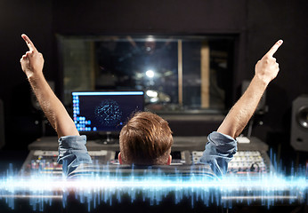 Image showing man at mixing console in music recording studio