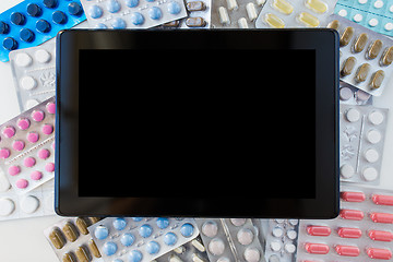 Image showing tablet pc with pills and capsules of drugs