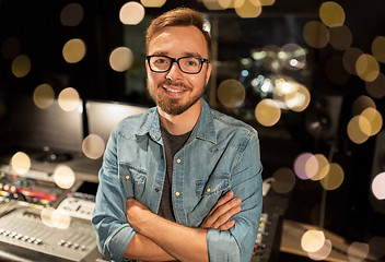 Image showing man at mixing console in music recording studio