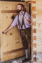 Image showing Bavarian man with an old pipe in his hand