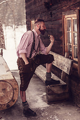 Image showing Bavarian man smoking