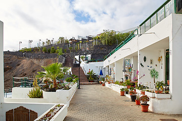 Image showing cottages of Puerto del Carmen town on the coast of Atlantic Ocea