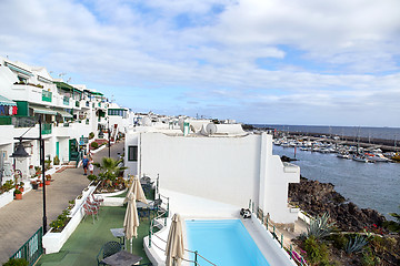 Image showing cottages of Puerto del Carmen town on the coast of Atlantic Ocea