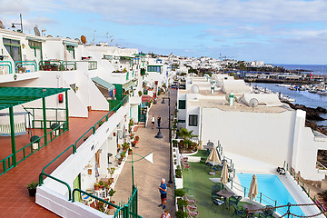 Image showing cottages of Puerto del Carmen town on the coast of Atlantic Ocea