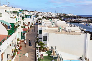 Image showing cottages of Puerto del Carmen town on the coast of Atlantic Ocea