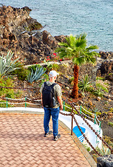 Image showing Tourist man enjoying panoramic view of Puerto del Carmen town 