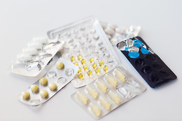 Image showing old open packs with pills and capsules of drugs