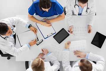 Image showing group of doctors with cardiograms at hospital