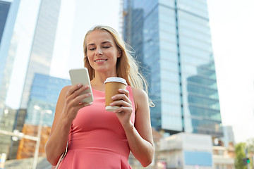 Image showing woman with coffee and smartphone in city