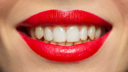 Image showing lips or mouth of smiling woman with red lipstick