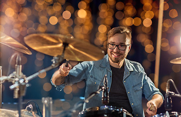 Image showing musician or drummer playing drum kit at concert