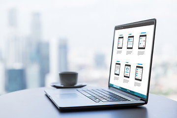 Image showing laptop with smartphone interface design on screen