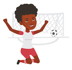 Image showing Soccer player celebrating scoring goal.