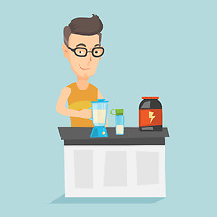 Image showing Young man making protein cocktail.