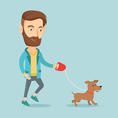 Image showing Young man walking with his dog.