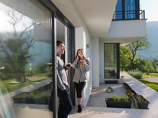 Image showing couple enjoying on the door of their luxury home villa