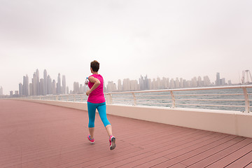 Image showing woman running on the promenade