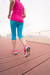 Image showing woman running on the promenade