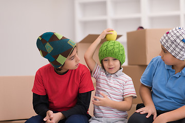 Image showing boys with cardboard boxes around them