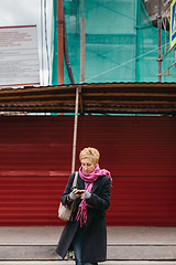 Image showing Woman with phone on city street