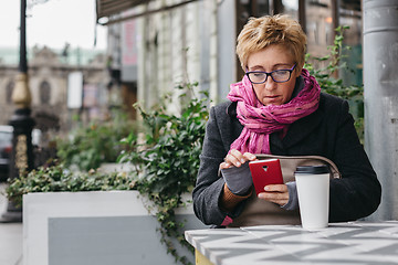 Image showing Adult woman surfing phone