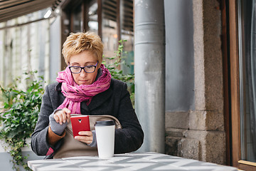 Image showing Adult woman surfing phone