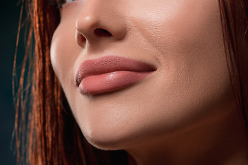 Image showing Beautiful woman face portrait close up on dark