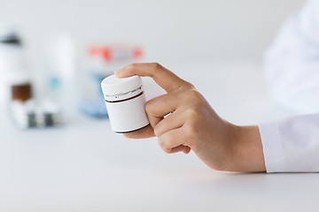 Image showing close up of doctor hand with medicines