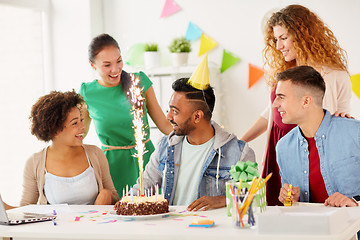 Image showing office team greeting colleague at birthday party