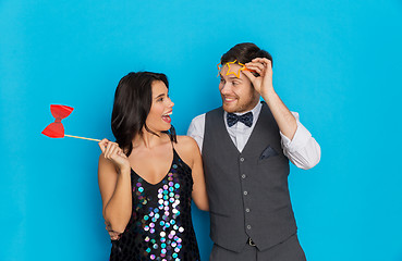 Image showing happy couple with party props having fun