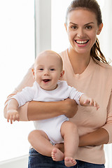 Image showing happy mother with little baby boy at home