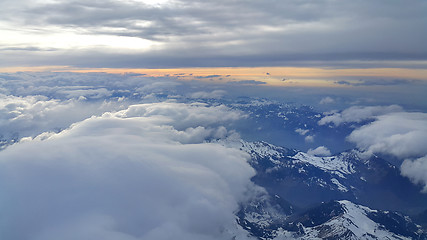 Image showing Top view on the Alps, covered with snow and clouds