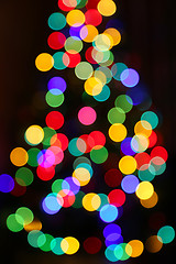 Image showing  Unfocused Christmas tree with colorful lights 